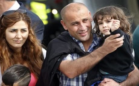 The first batch of 101 refugees from Syria arrives in the city of Hannover in Germany in September 2013. AP photo.