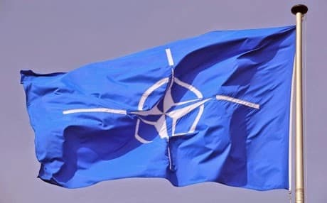 NATO flag flying at NATO Headquarters Brussels. AP photo