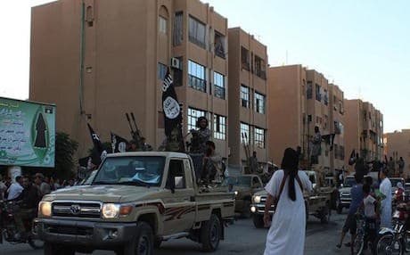 ISIS militants parading through the streets of the Syrian city of Raqqa, June 2014. AFP file photo