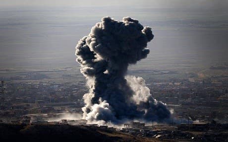 A thick plume of smoke rises from an explosion inside Shingal. Rudaw photo.