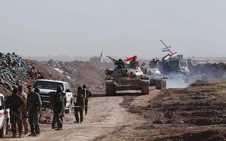 Peshmerga forces entering Bashir on Saturday. AFP photo.