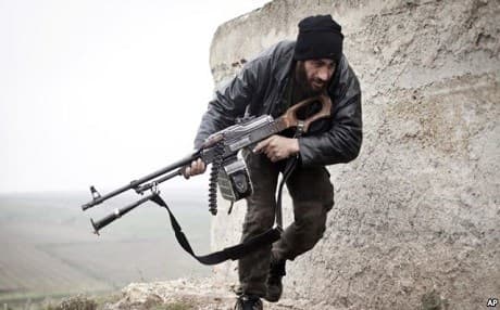 AP file photo of a Syrian rebel fighting government forces near Azaz.
