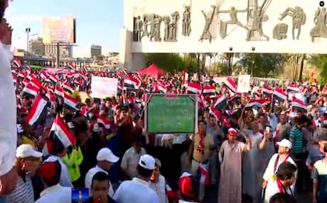 Anti-government protesters rally in Baghdad's Tahrir Square on Friday