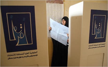 An Iraqi woman reading a ballot sheet in the southern city of Basra. Photo: AFP