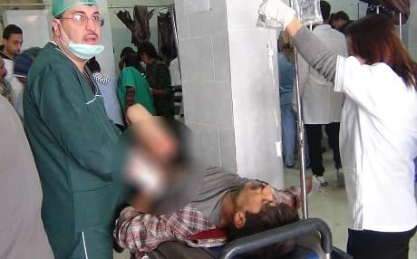 An injured person from today's attack receives treatment in a local hospital in Afrin. Photo: ANHA