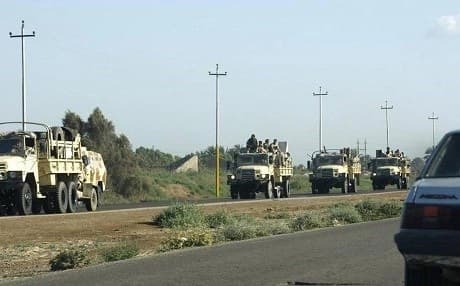 A convoy of Iraqi army vehicles driving out of Hawija, southern Kirkuk. AP File Photo