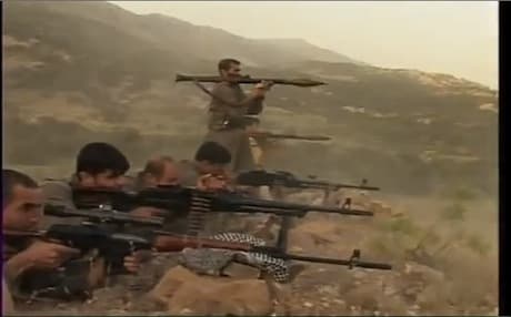PJAK fighters training on their guns near the Iranian border. Photo: Youtube