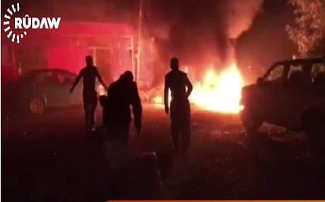 Members of the group trying to put out a fire that started from the explosion targeting their base in Koya.