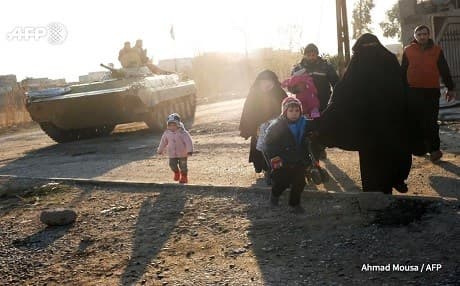 Civilians flee al-Mithaq in southeastern Mosul last week. Photo: Ahmad Mousa/AFP