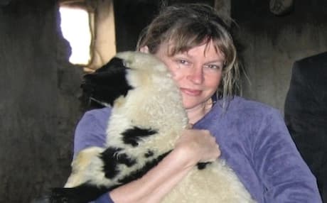 Diane Edgecomb holding a lamb on a visit to a Kurdish village in Turkey. Photo by Tom Megan
