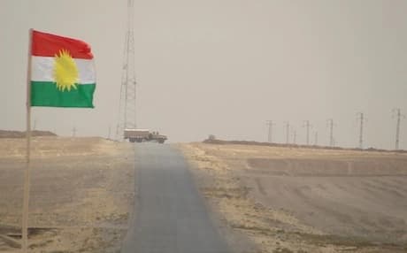 A Kurdish flag by the road in a stretch of land controlled by the Peshmarga near the Syrian border and Nineveh. Photo: Rudaw