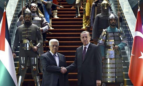 Erdogan (right) with Abbas at a lavish ceremony at the new presidential palace. AP photo.