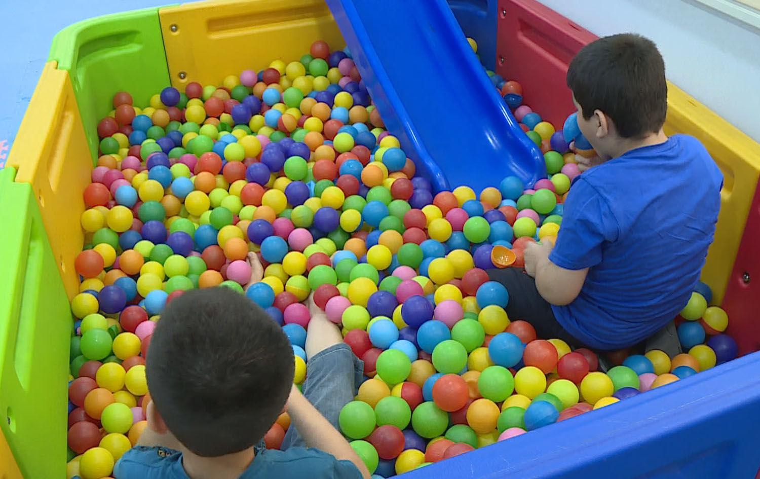 Two autistic children play with balls in a vocational centre in Sulaimani province. Date: August 2023. Photo: Rudaw