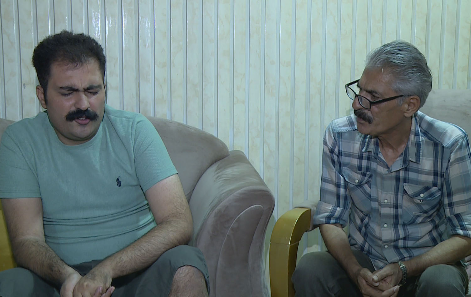 Aras Osman (right) and his 27-year-old son at their home in Sulaimani province in August 2023. Photo: Rudaw 