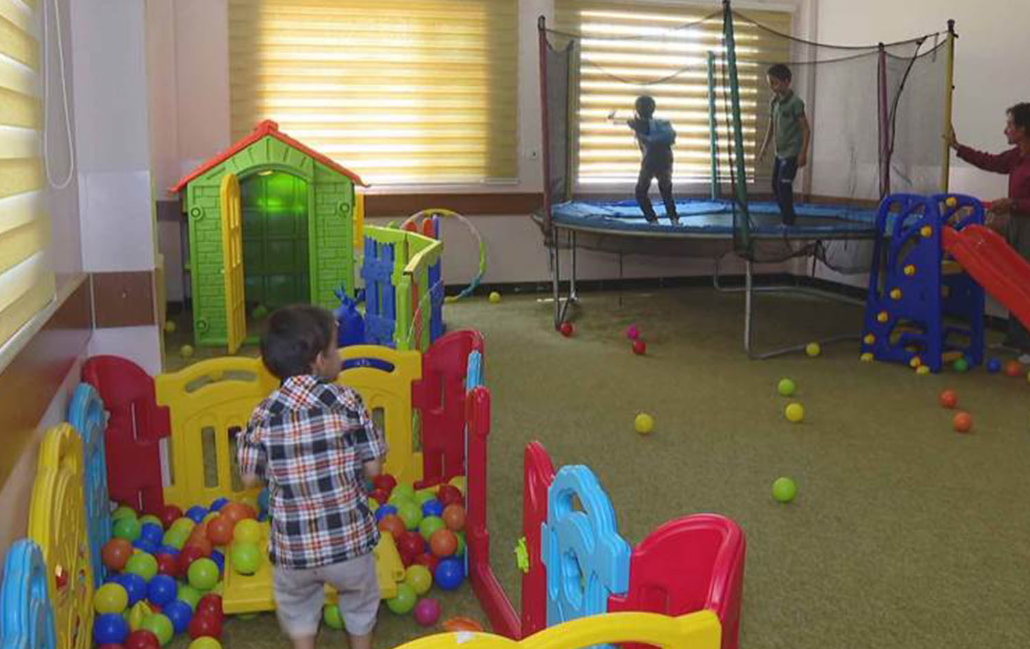 Autistic children play in a vocational centre in Halabja province. Date: August 2023. Photo: Rudaw