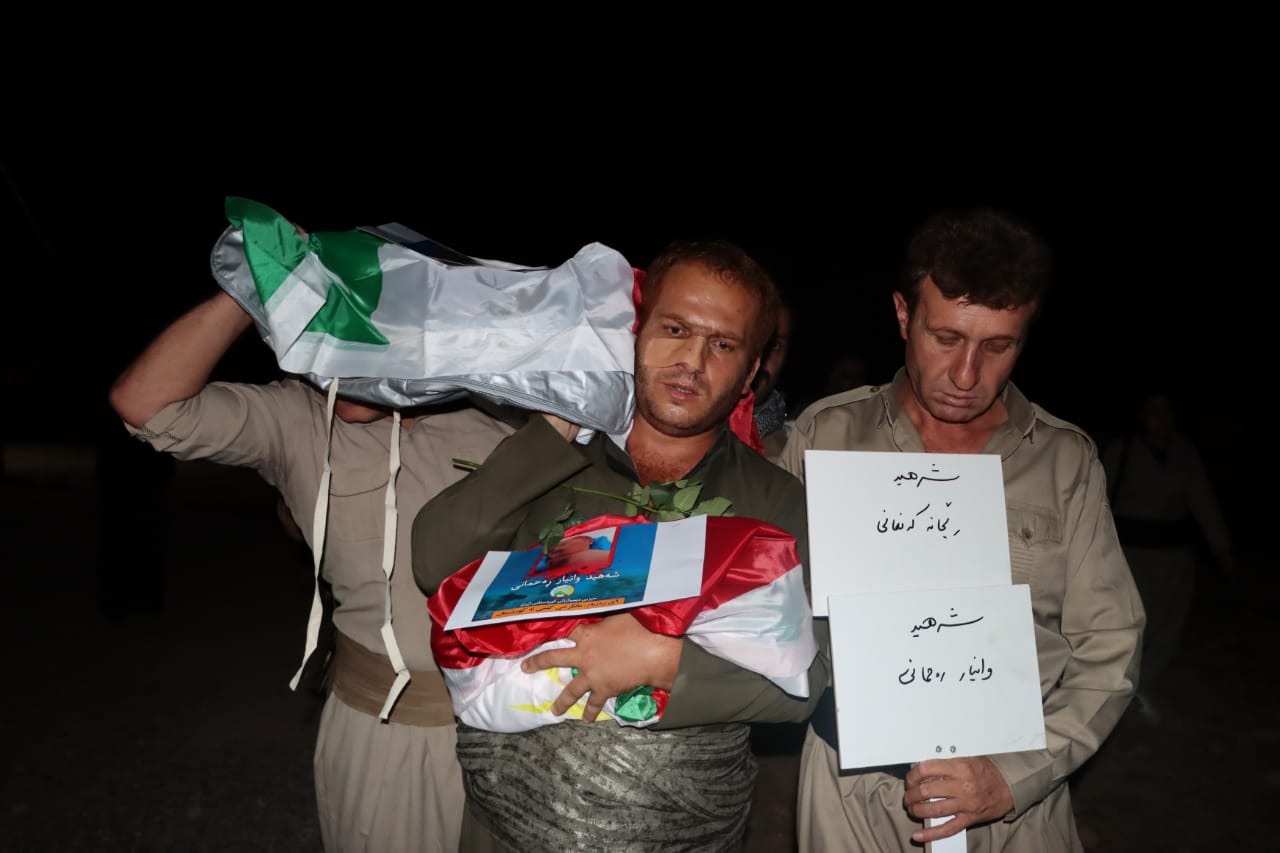 Zanyar Rahmani holding the lifeless bodies of his wife and baby ahead of their burial in Koya on September 30, 2022. Photo: Submitted