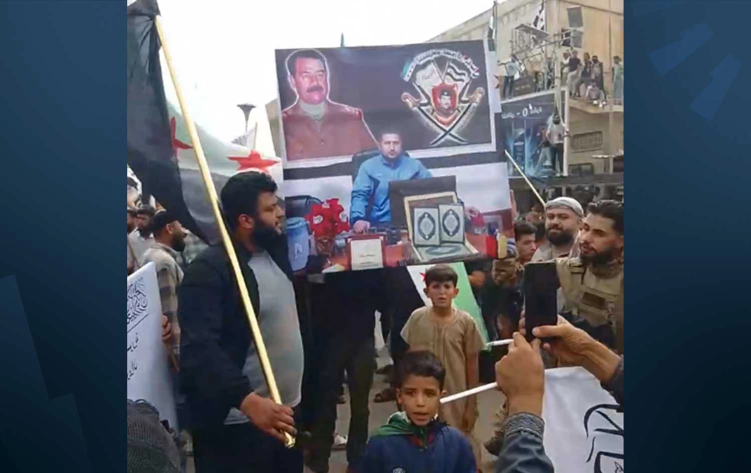 Saddam Hussein portrait raised by pro-government Arab protesters in Hasaka