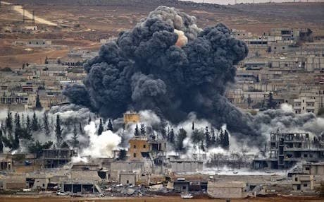 Smoke rises from the Kurdish city of Kobane following an American airstrike against ISIS positions in November. Photo: AP.
