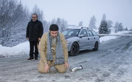 Mulla Krekar kneels to pray after being released from Kongsvinger prison in Norway late last month. AP photo.