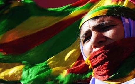A PKK supporter in Diyarbakir dressed in the group's tricolor banner. Photo: AFP 
