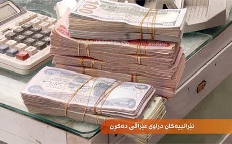 ئێرانییەکان دراوی عێراقی دەکڕن