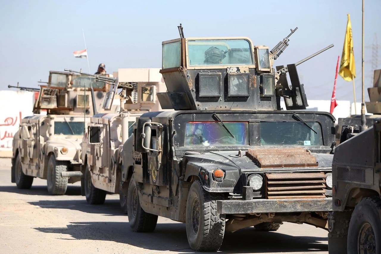 Iraqi troops gathered on the outskirts of Tikrit on Tuesday as they prepared to try to regain control of the city from ISIS. AFP photo.