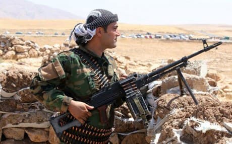 A Kurdish Peshmerga fighter takes up position in the town of Bashik, northeast of Mosul. AFP file photo