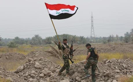 Iraqi Shitte fighters take part in a military operation to take control of Tikrit from Islamic State. AP file photo.
