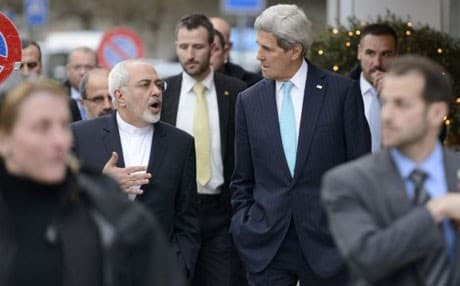 US Secretary of State John Kerry (R) speaks with Iranian Foreign Minister Mohammad Javad Zarif (L) as they walk in the city of Geneva, on January 14, 2015. AP Photo