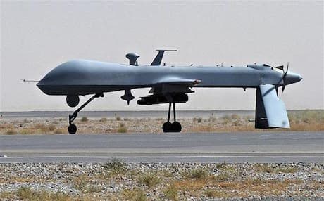 AP File Photo: US Predator unmanned drone armed with a missile on the tarmac of Kandarhar, military airport in Afghanistan 2010.