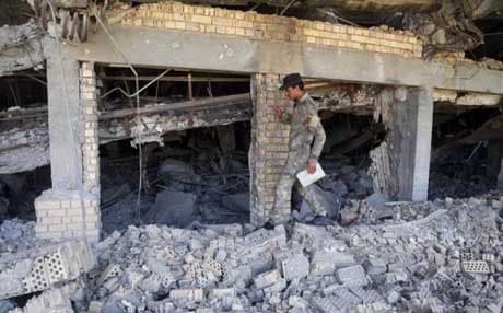 An Iraqi soldier inspects the demolished tomb of former Iraqi president Saddam Hussein in Tikrit. AP file Photo. 