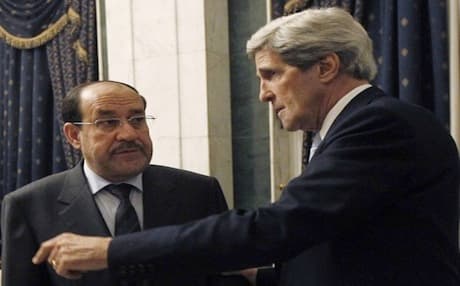 US Secretary of State John Kerry (R) talking to Iraqi Prime Minister Nuri al-Maliki during an unannounced visit to Baghdad in March, 2013. Photo: AFP