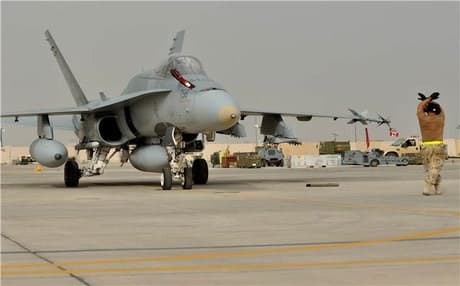 A Canadian Hornet fighter jet returns to base after the first airstrike over Syria on Wednesday. Photo: DND.