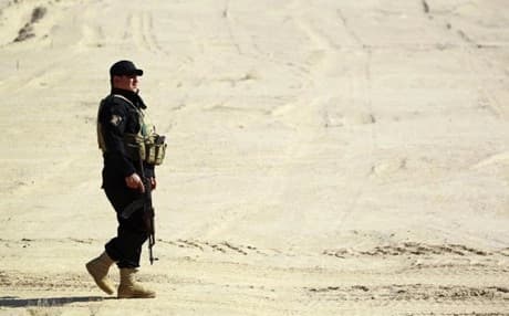 A member of Iraqi forces patrols in a deseart in Anbar province during a military campaign against ISIS. AFP file photo.