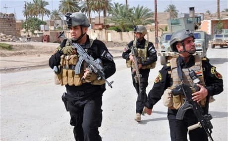 Members of the Iraqi Emergency Response Brigade patrol the streets of Ramadi in the Anbar province. AFP file Photo.