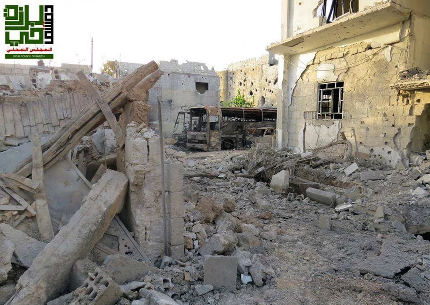 This image shows homes destroyed by government airstrikes and shelling, in the Barzeh district of Damascus. AP file photo. 