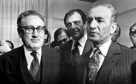 File photo of Henry Kissinger (left) with the Shah of Iran. 