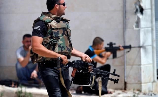 Syrian rebels are seen fighting government troops. AP file photo.