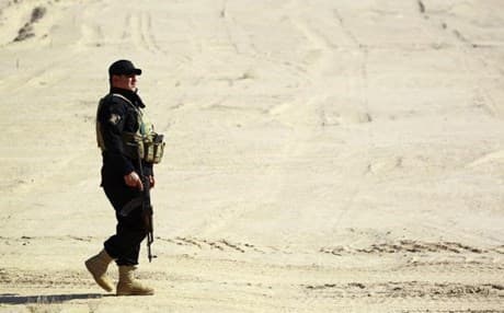 A member of Iraqi forces patrols in a deseart in Anbar province during a military campaign against ISIS. AFP file photo.