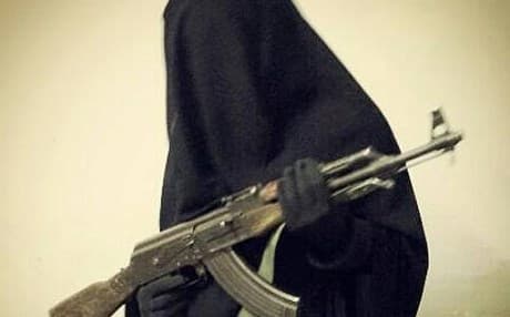 ISIS social media posted image of a female member holding an AK-47 