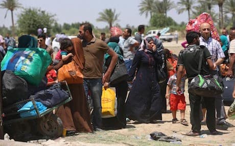 AP Photo:  Iraqis fleeing from their hometown of Ramadi, Iraq, rest near the Bzebiz bridge, 65 kilometers (40 miles) west of Baghdad on Saturday, May 16.