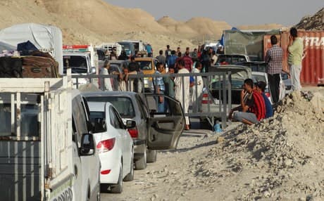Iraqis preparing to leave Ramadi ahead of the ISIS takeover of the city on Sunday. AP photo.