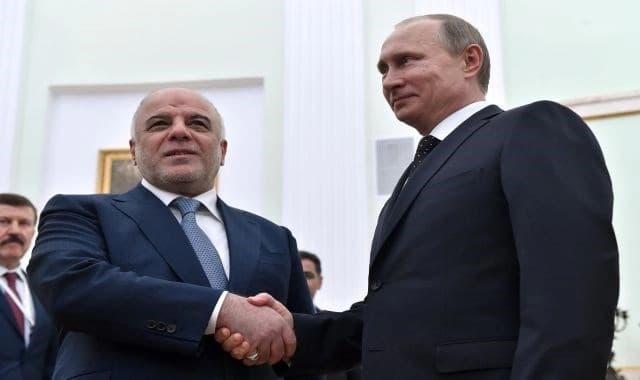 Haider al-Abadi, Vladimir Putin. AP file photo. 