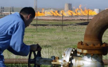 An oil worker tending to a supply pipeline in Iraqi Kurdistan. AFP photo