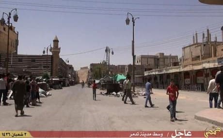 A picture from a video released by jihadi media allegedly shows people in Palmyra after the ISIS takeover. Photo: AFP.