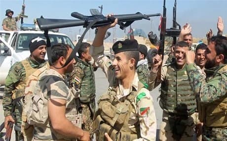  Iraqi forces celebrating victory in Salahadin province. AFP photo. 