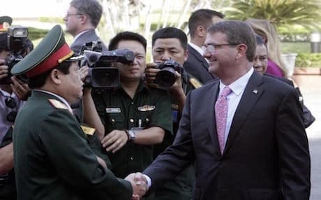 U.S. Defense Secretary Ash Carter, right, shakes hands with his Vietnamese counterpart Gen. Phung Quang Thanh before their talks behind closed doors in Hanoi, Vietnam Monday, June 1, 2015. Carter is on a three-day visit to Vietnam to deepen military cooperation between the two former foes — AP Photo.