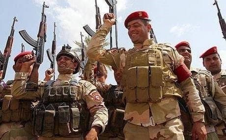 Iraqi forces celebrating victory in Salahadin province. AFP photo.