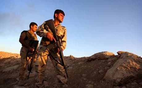 Kurdish Peshmerga fighters take position on the front line in Makhmur. AFP file photo 