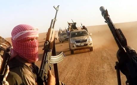 An image taken from an ISIS propaganda video purports to show militants driving in Salahadin province. AFP file photo